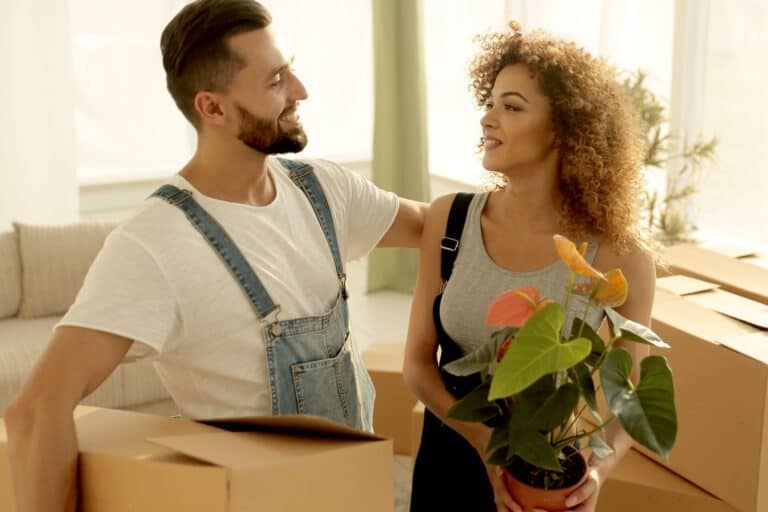 Newlyweds in their new apartment in the concept of relocation