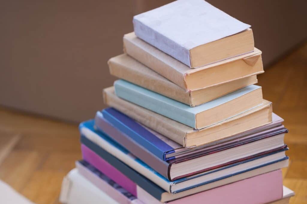 A pile of books on the floor