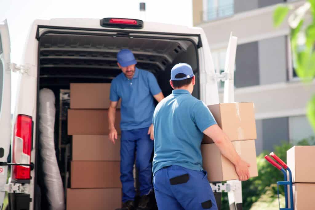 Man and van loading boxes into the van